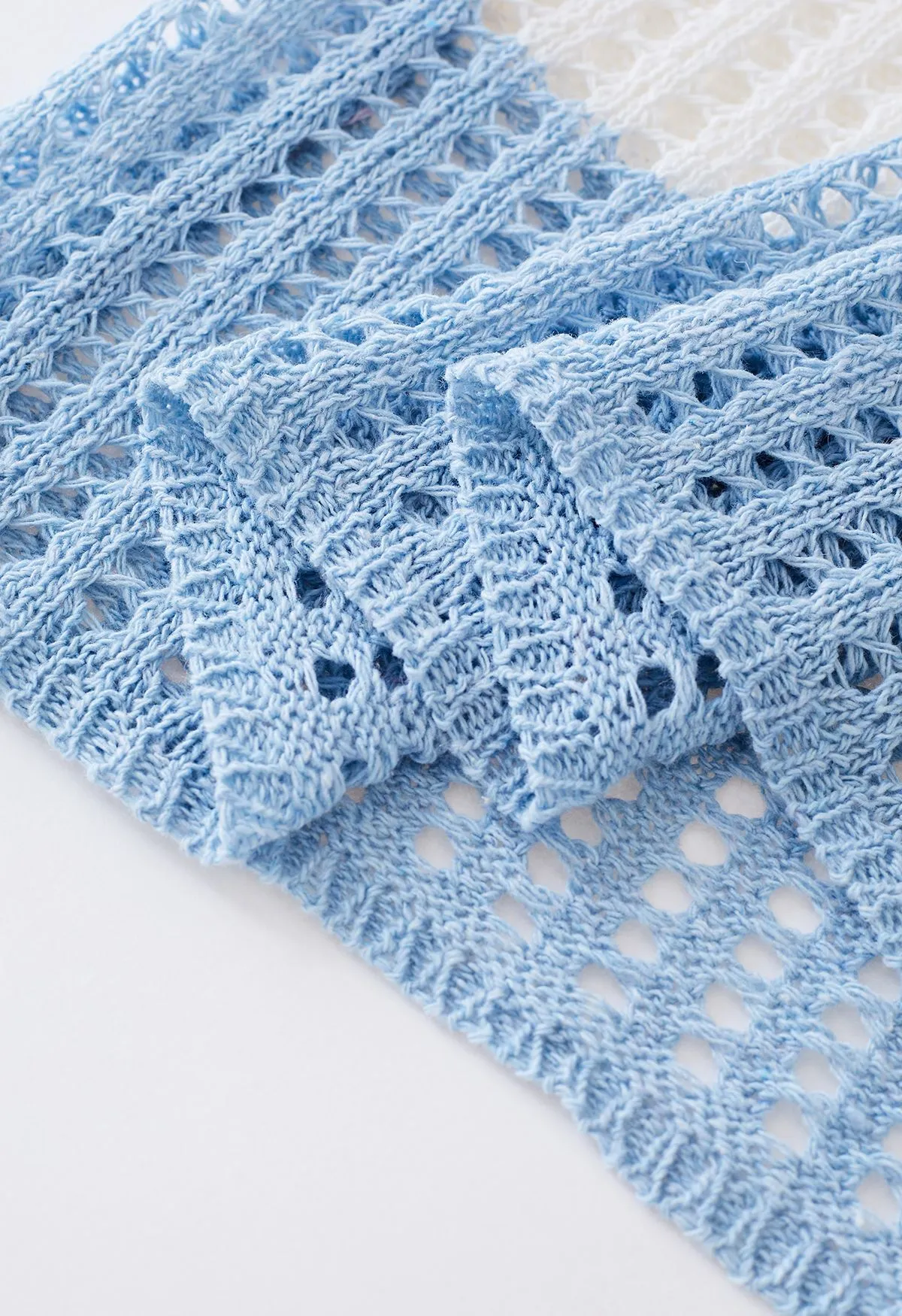 Couverture en tricot évidé à rayures colorées