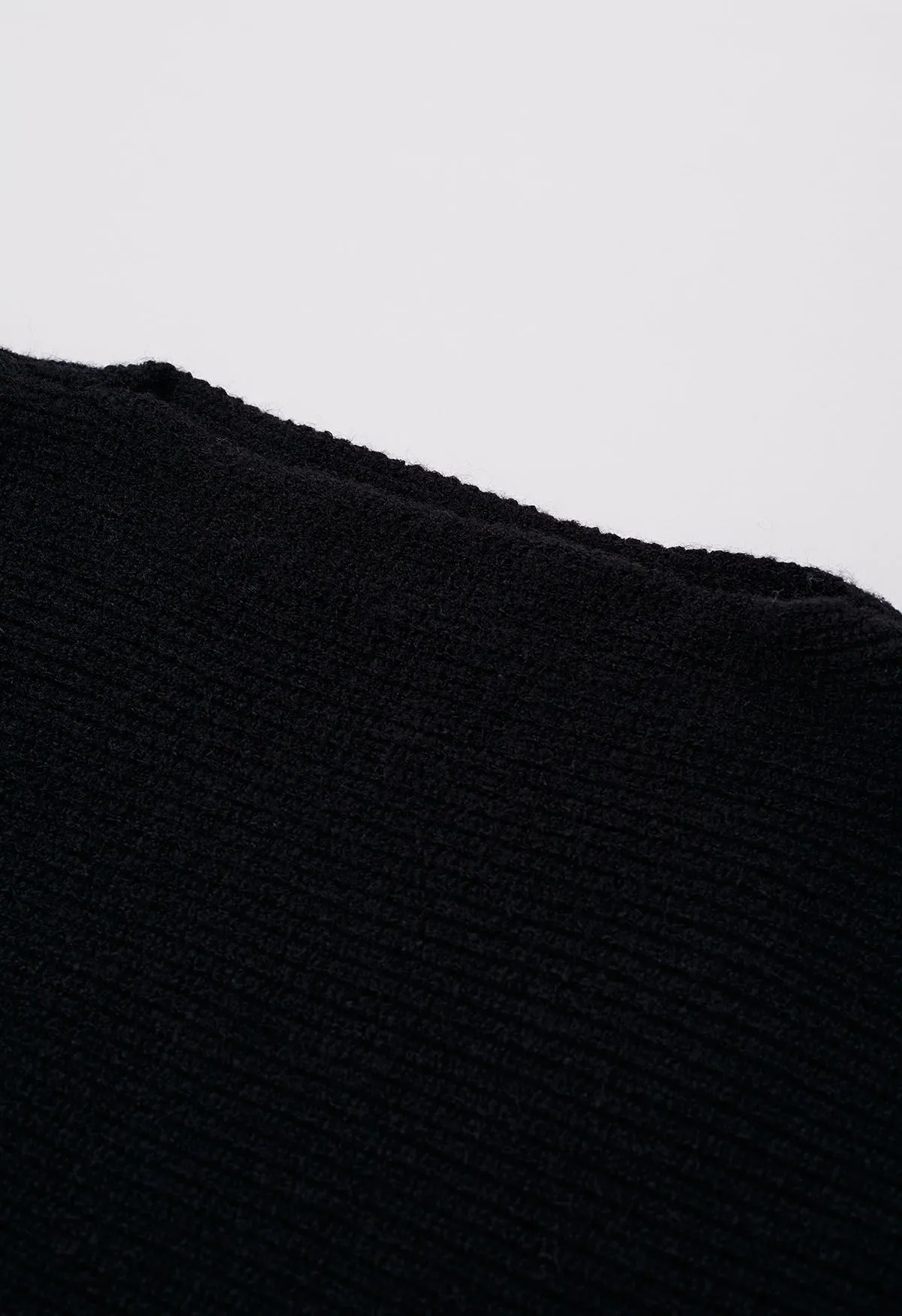 Haut en tricot à encolure bateau et manches bouffantes exagérées en noir